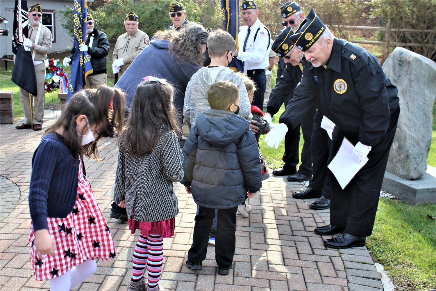 Students from the Mackensie Elementary preschool class greet the veterans and thank them for their service.